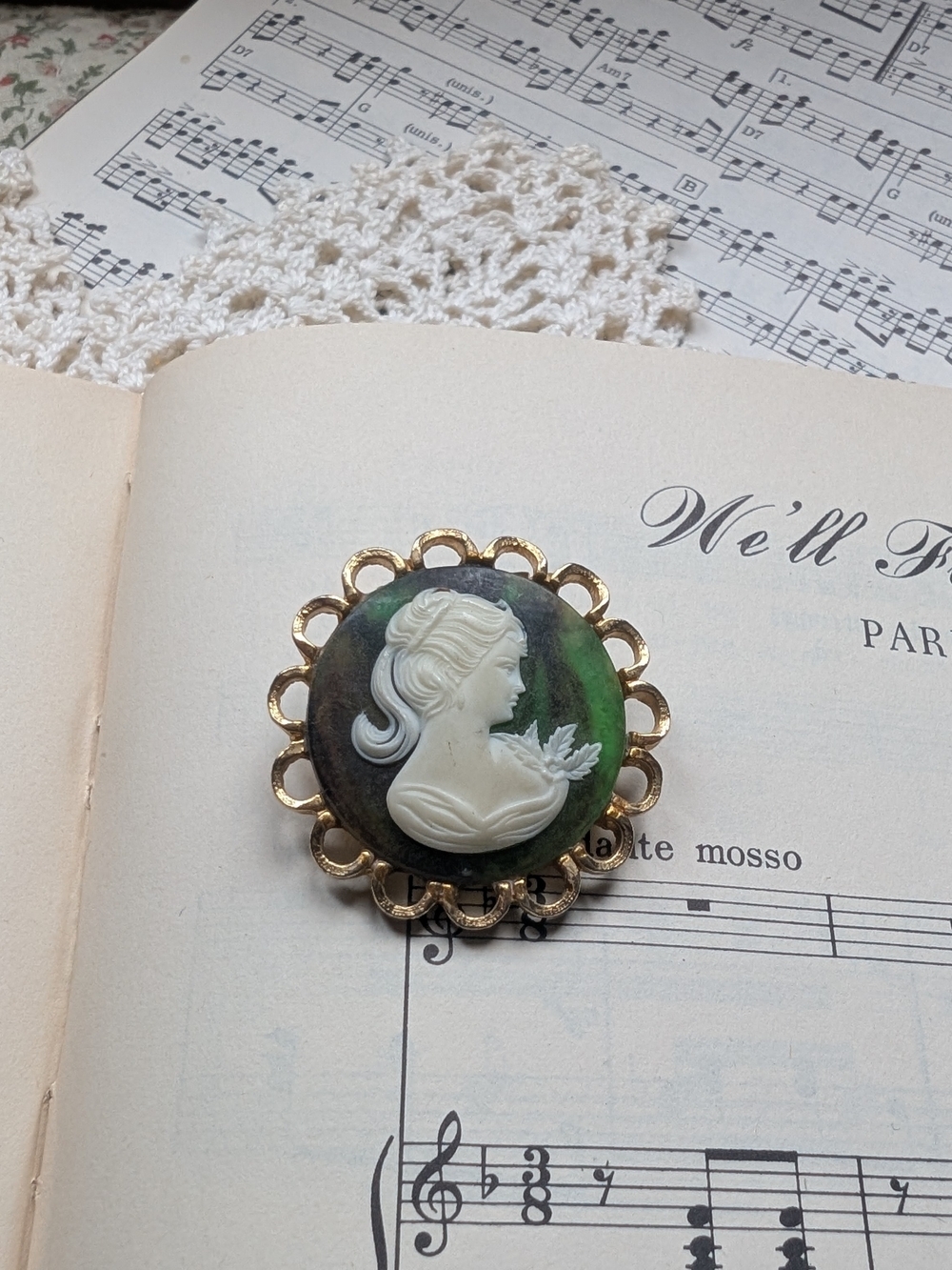 Vintage Style White Cameo Brooch with Green and Black Background